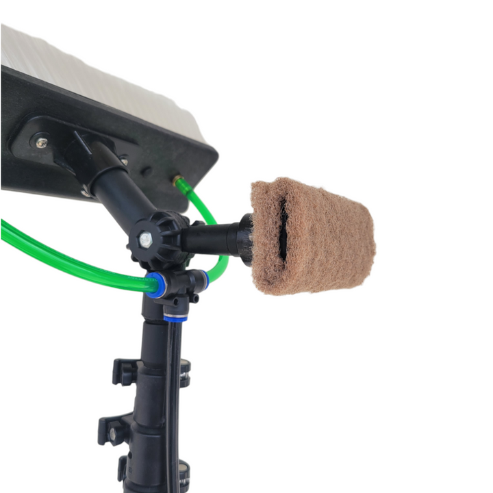 Scrub pad fitted to the back of a water fed brush.