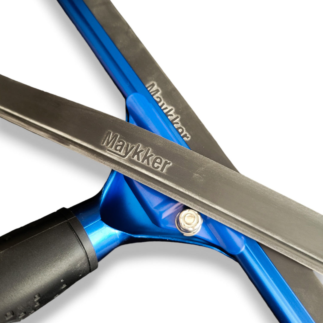 The Maykker squeegee rubber being showcased in a squeegee handle with a another piece laying over the top.