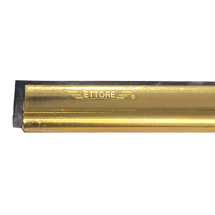 "Close-up of Ettore brass squeegee channel showing the engraved brand logo and rubber blade edge.