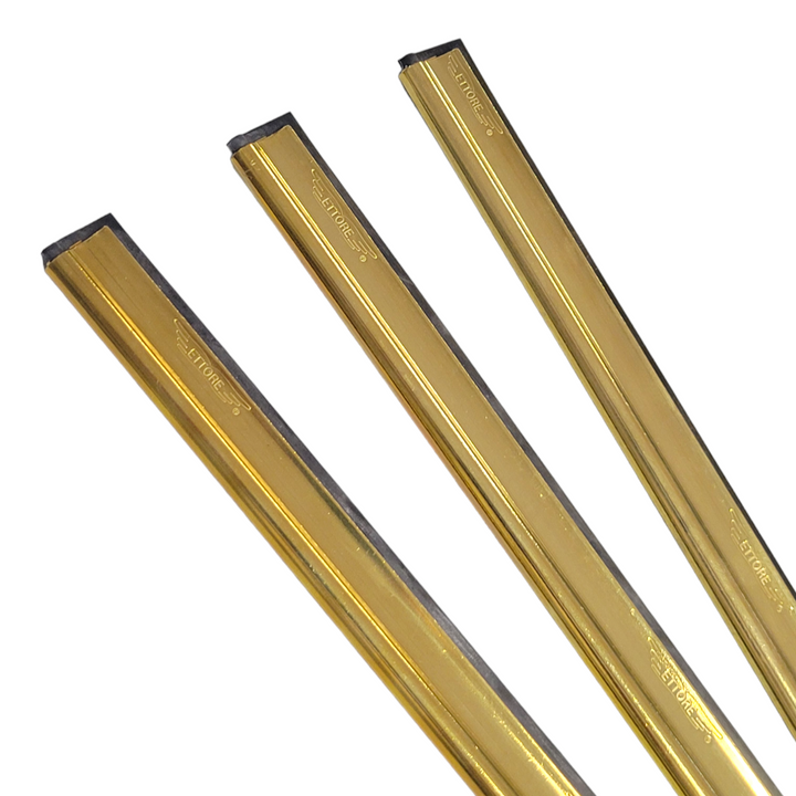 Multiple sizes of Ettore brass squeegee channels with black rubber blades on a white background.