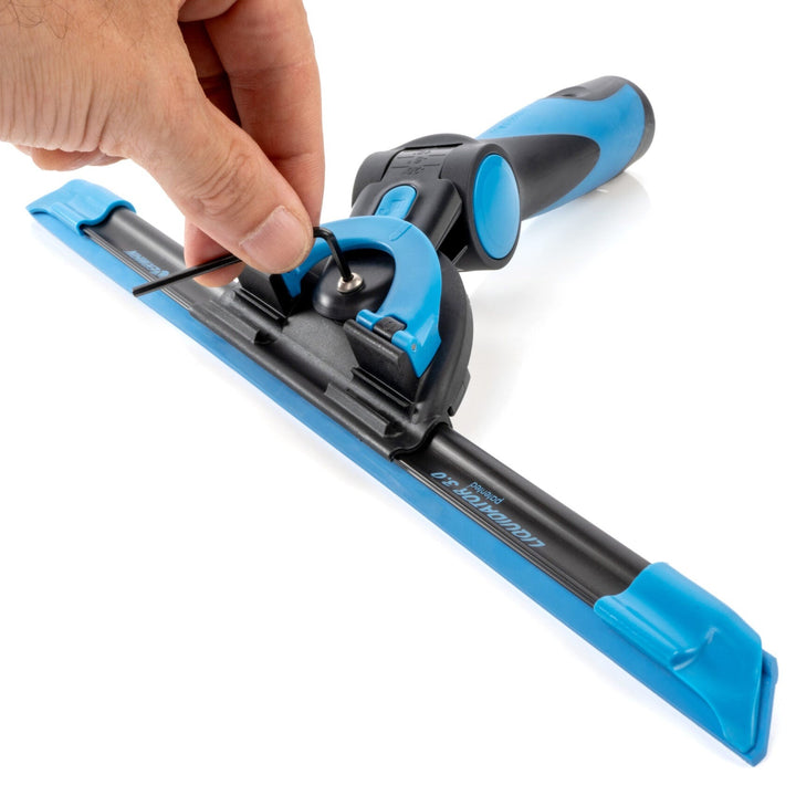 Close-up of a hand adjusting the Excelerator 2.0 squeegee handle's blue hex friction adjuster on a black and blue squeegee channel.