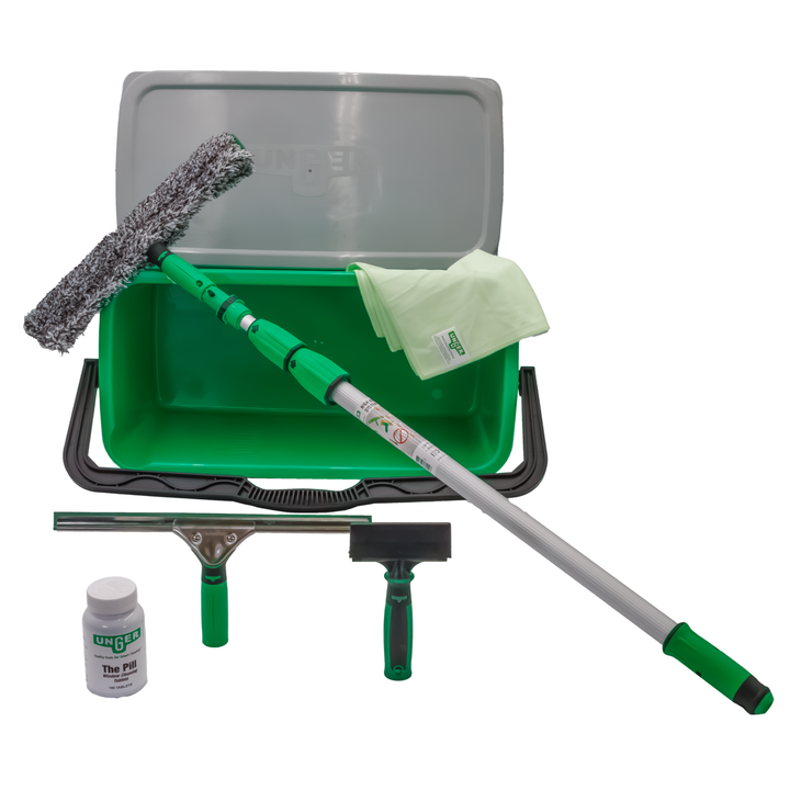 Top-down view of the Unger window cleaning kit components arranged around the green bucket
