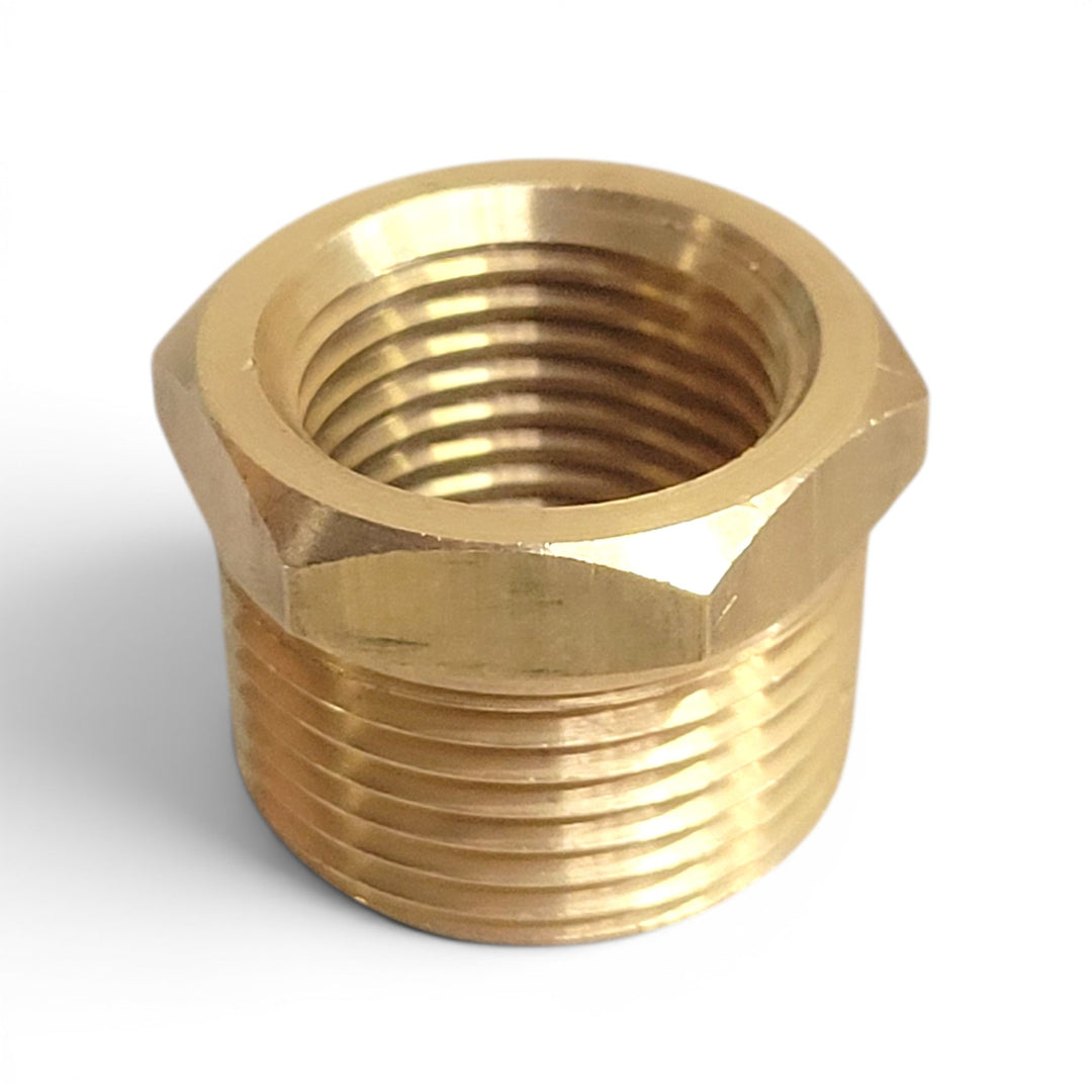Brass plumbing fitting on a white background