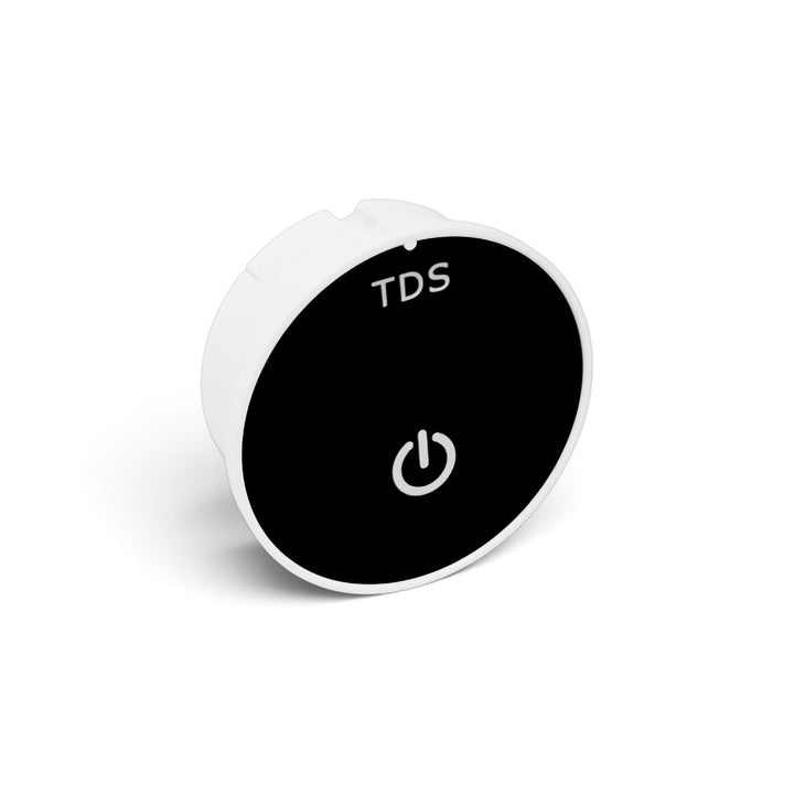 Angled front view of the white TradeWRX inline TDS meter with black display and power button.