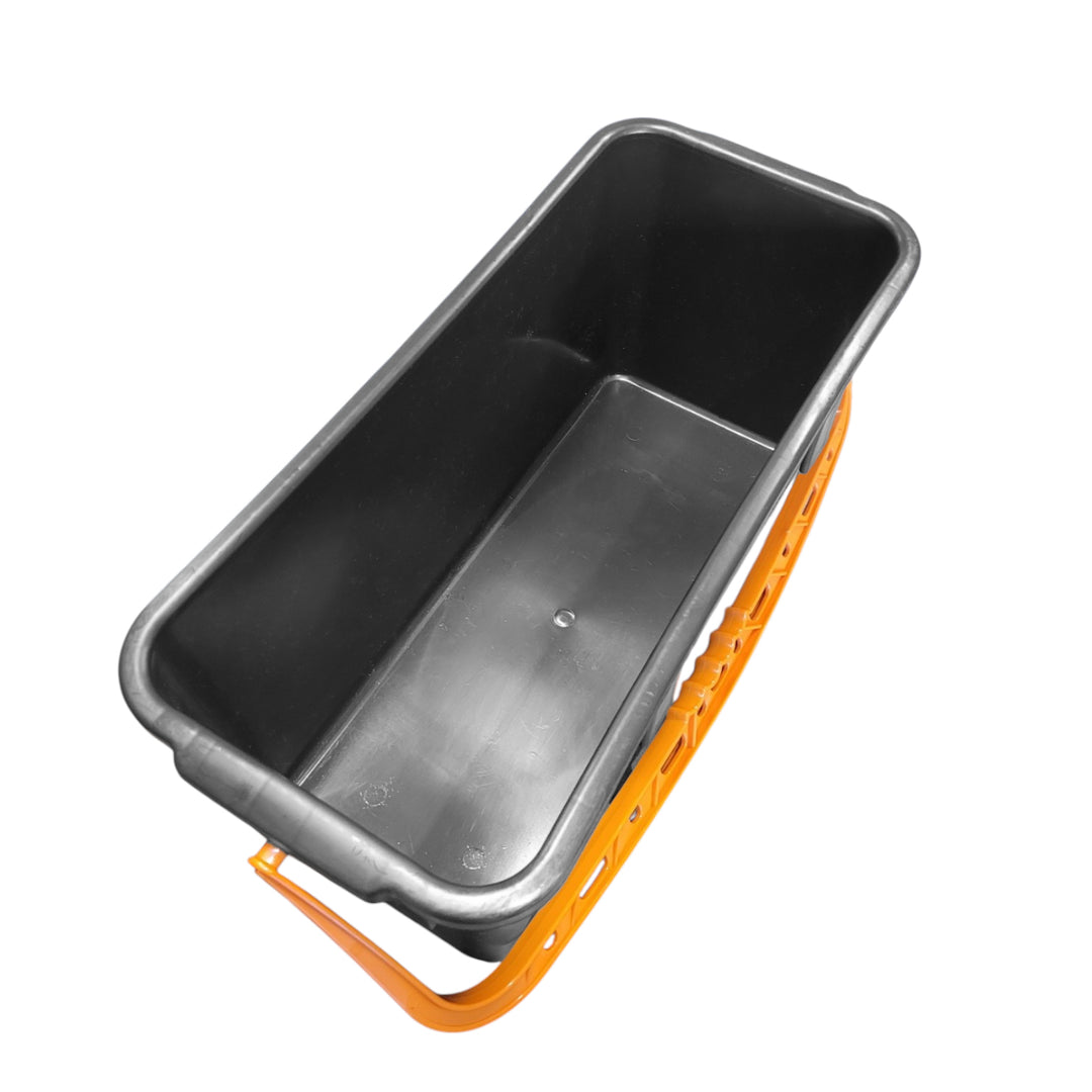 Interior of a black window cleaning bucket with an orange handle on a white background