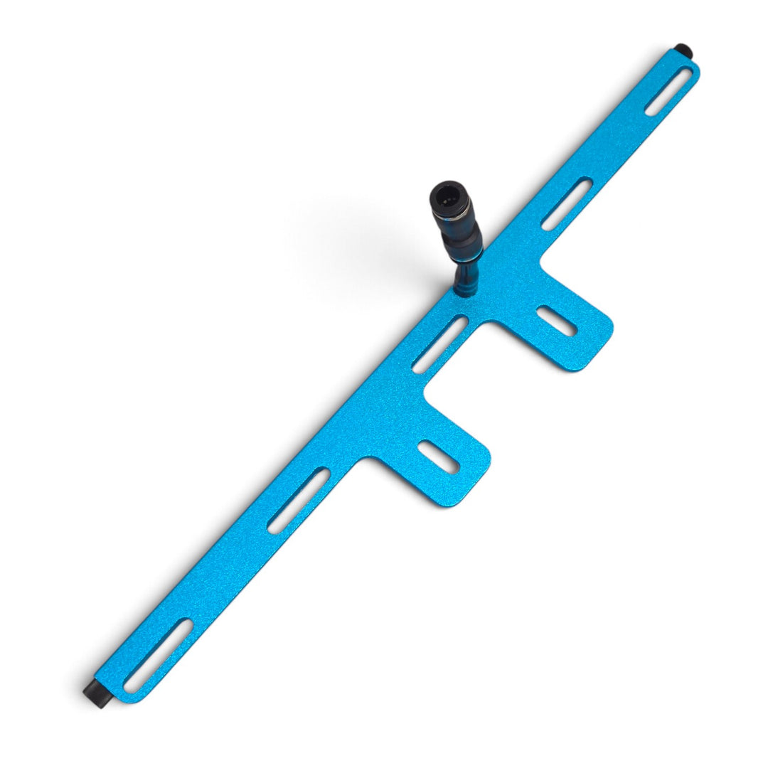 Turquoise PWP aluminum rinse bar with central push-fit connector and slotted mounting tabs, angled view.
