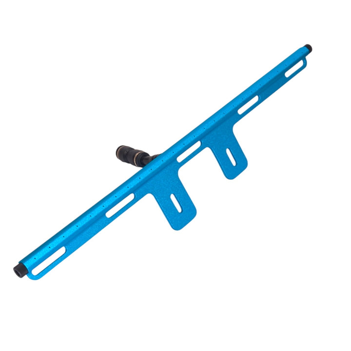 Top view of the turquoise PWP aluminum rinse bar with central water inlet and mounting slots.