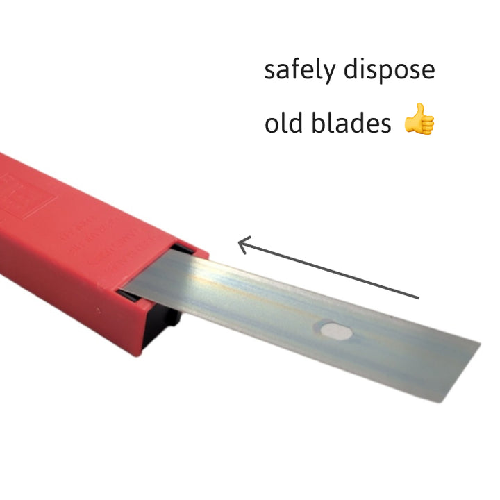 A stainless steel scraper blade extends from a red plastic safety dispenser with a built-in disposal reservoir on the back for used blades, as indicated by an arrow and the text 'safely dispose old blades' with a thumbs-up emoji.