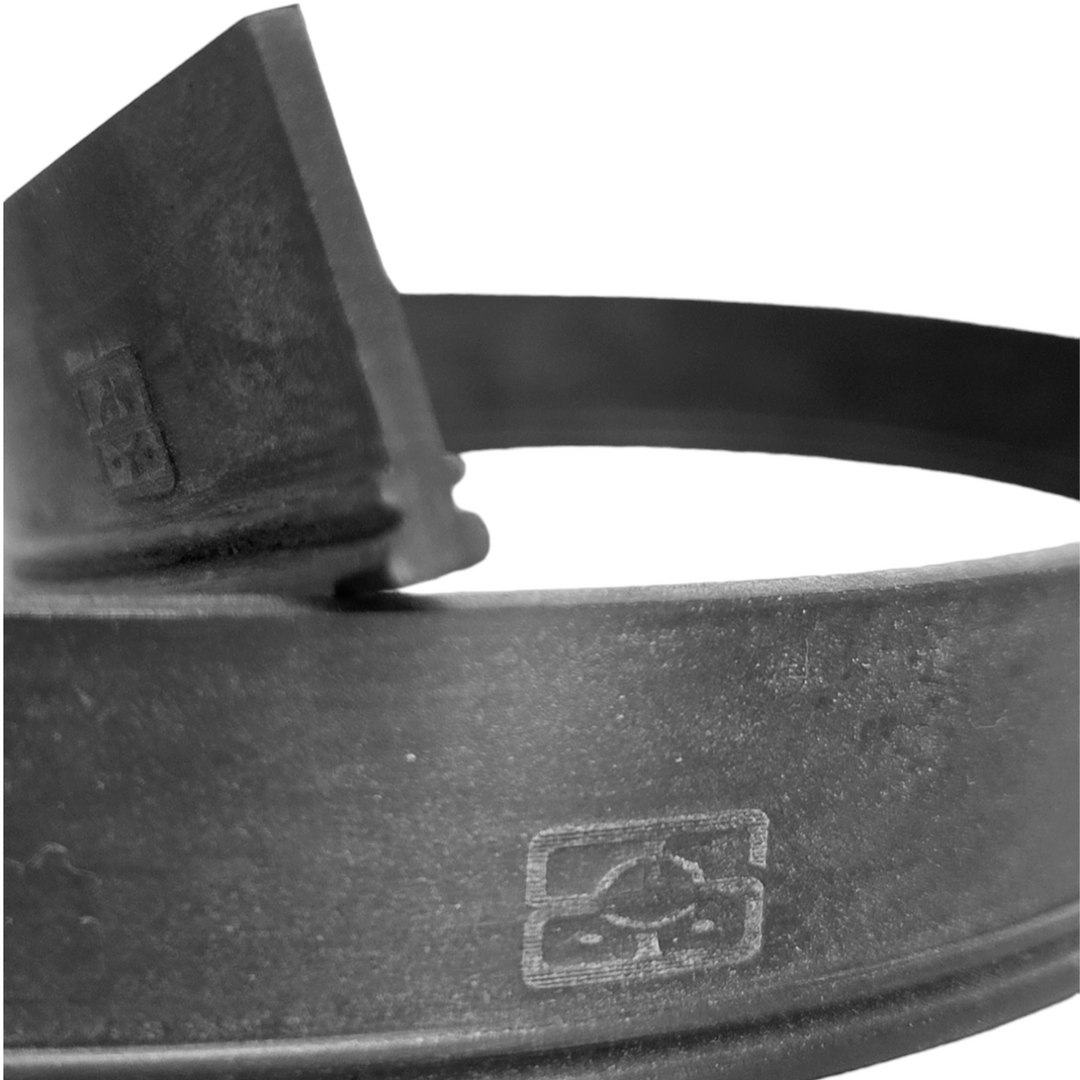 Close-up of the end of a black squeegee rubber blade, focusing on the T-shaped notch designed for secure fitting into squeegee channels. The blade's texture and the embossed recycling symbol on the rubber indicate its quality and consideration for environmental standards.