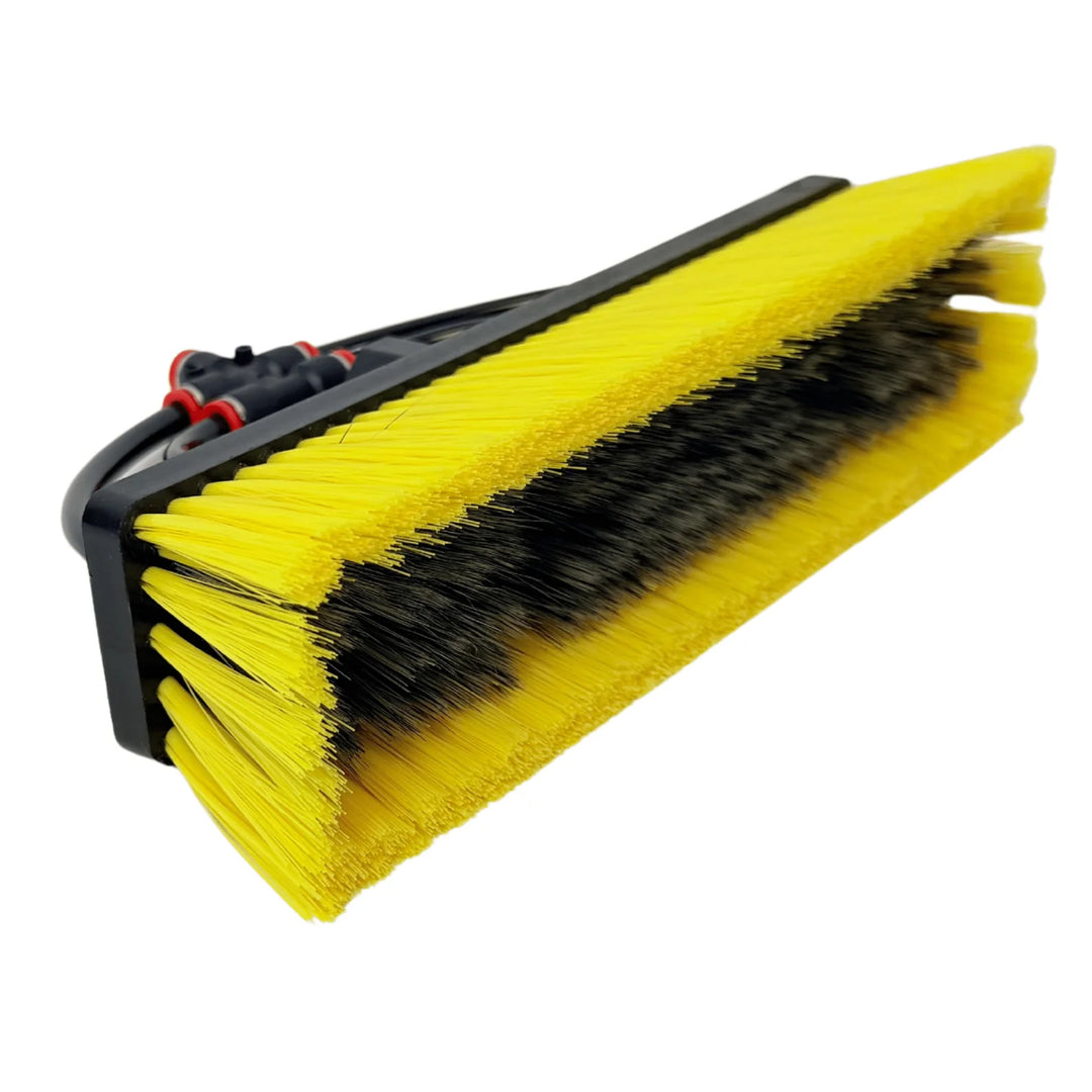 Angled side view of the Tucker Glide Hybrid water-fed brush showing its yellow outer and black inner bristle rows.